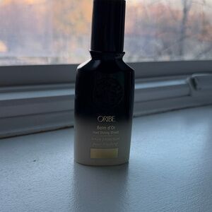 Oribe Balm d'Or Styling Shield in Black and Cream